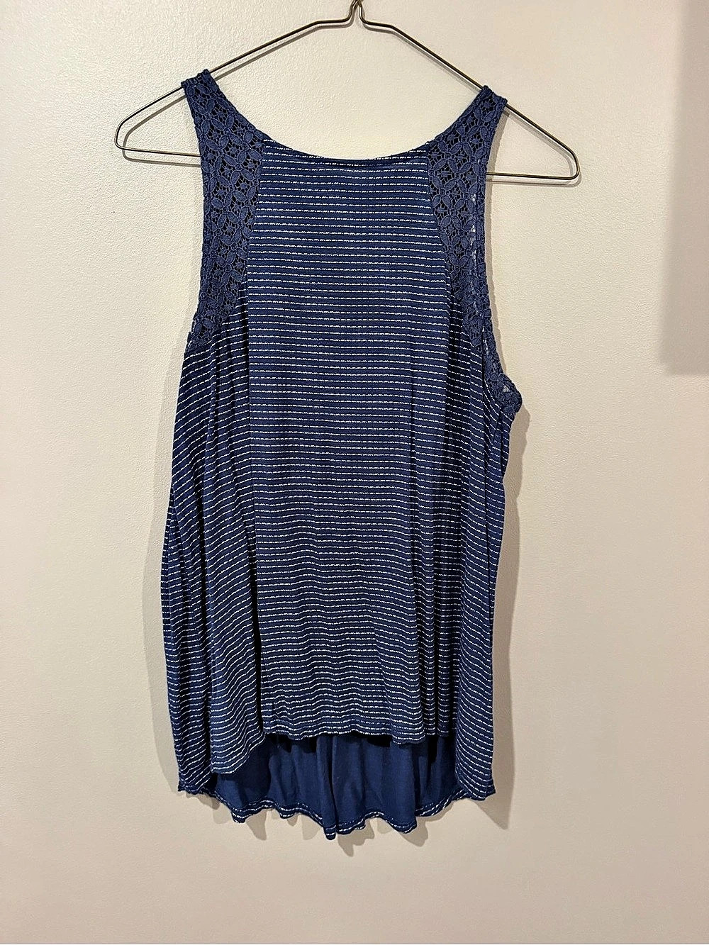Maurice’s women’s blue tank top with vertical white stripes.